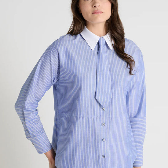 blue pinstripe shirt with a tie and contrasting white collar