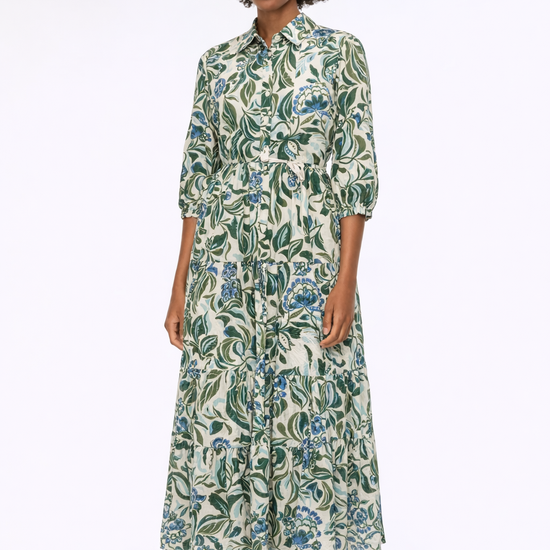 Gree floral dress on a model on white background 