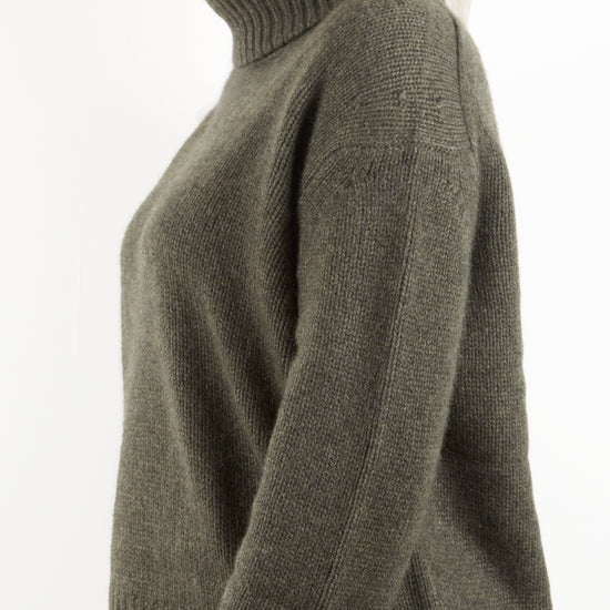 Side view of roll neck knit in heavy gauge cashmere