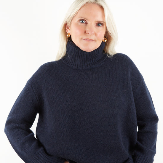 Heavy weight navy cashmere knit on model