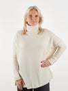 Ecru roll neck in heavy weight cashmere with a neat ribbed sleeve