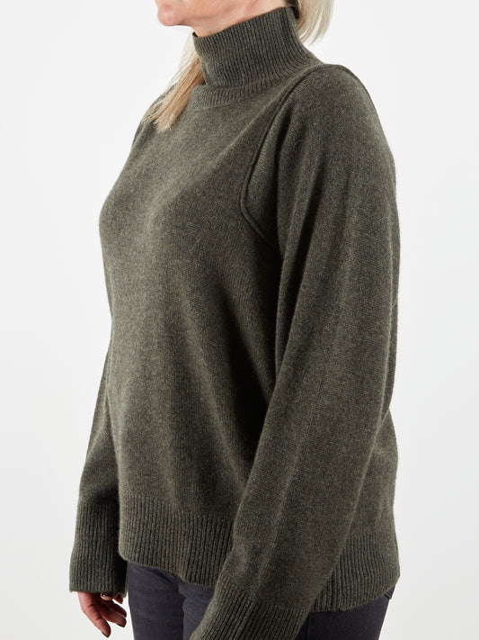 Side view of shoulder detail of cashmere knit in dark green