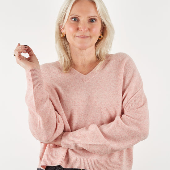 pale pink v neck cashmere knit on model