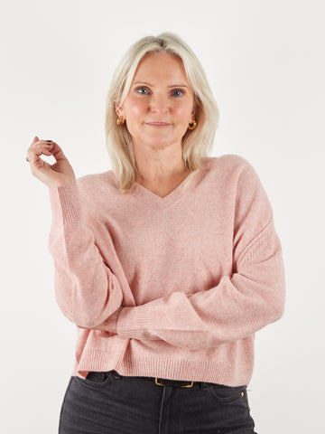 pale pink v neck cashmere knit on model