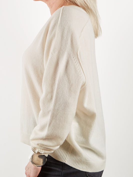 Side view of ecru cashmere knit