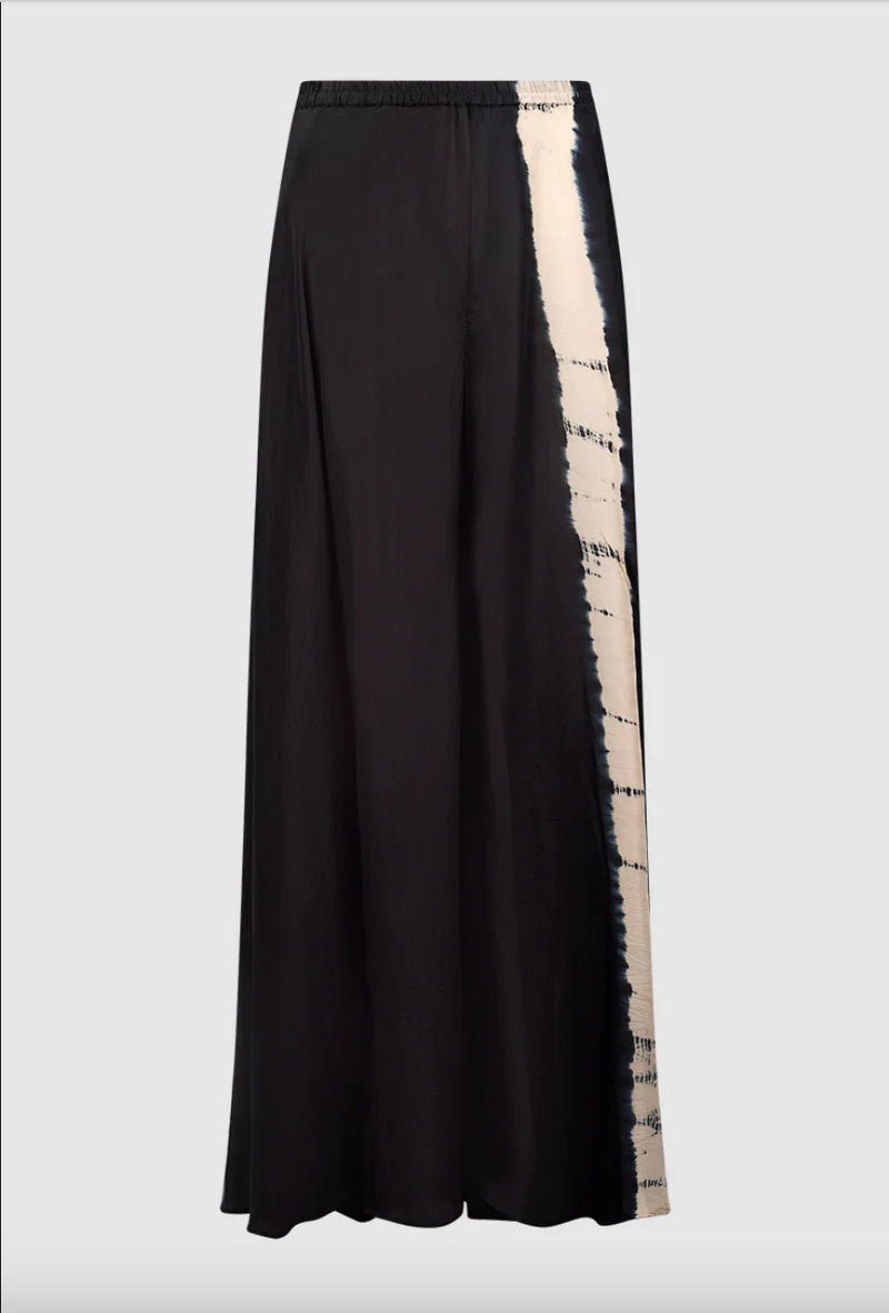 Wide leg black silk trousers with a tie dye feature leg and an elasticated waistband