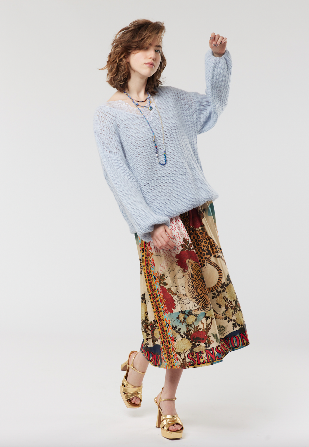 Pull on skirt with elasticated waist tiger and oriental flower imagery with Sense of Wonder wording at the bottom