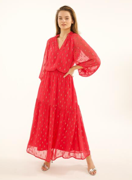 Raspberry pink sheer maxi dress with long balloon sleeves a shirred waist and double tiered skirt