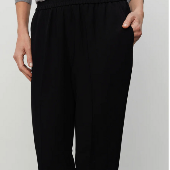 Pull on black tailored trousers with an elasticated waistband and side pockets