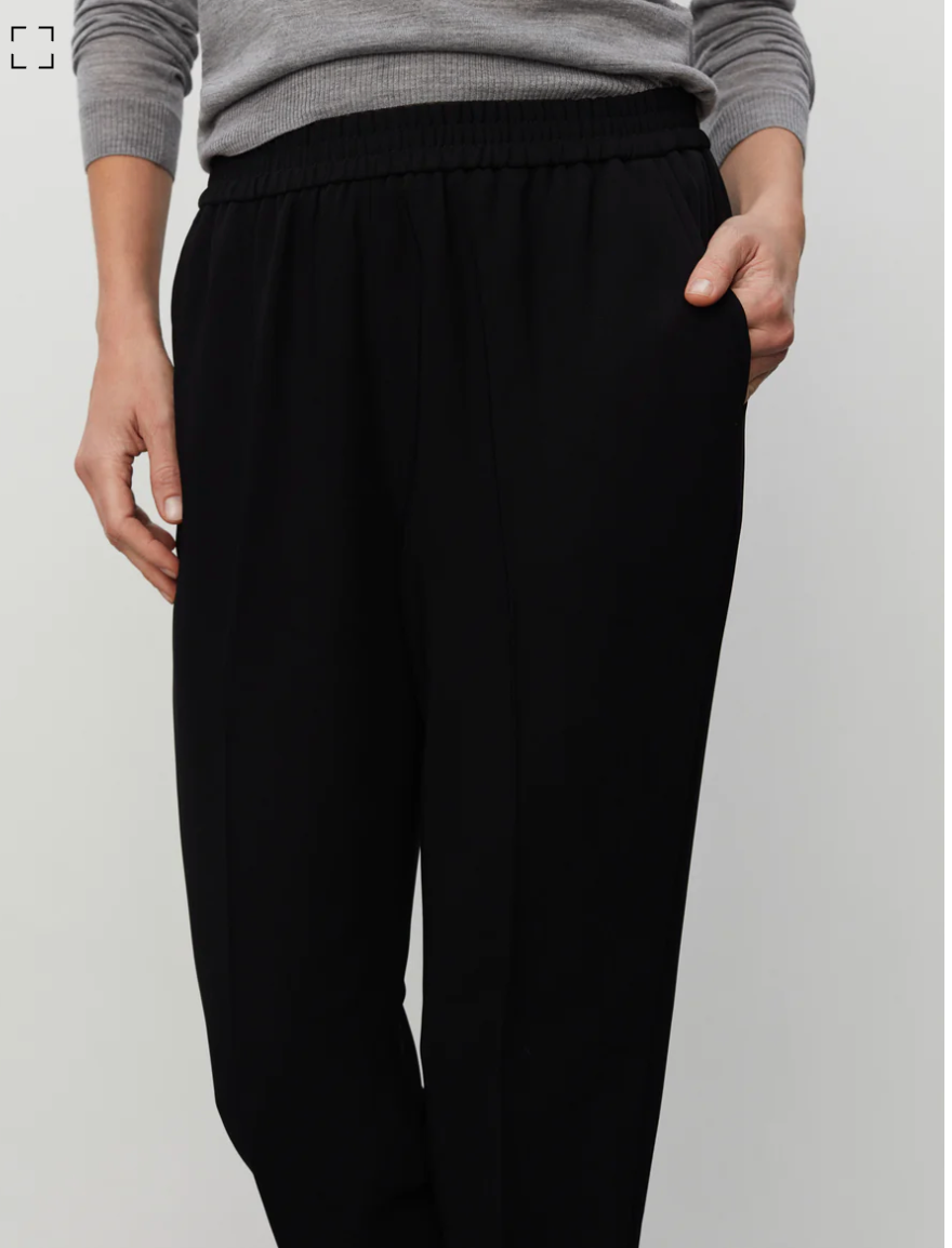 Pull on black tailored trousers with an elasticated waistband and side pockets