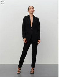Pull on black tailored trousers with an elasticated waistband and side pockets