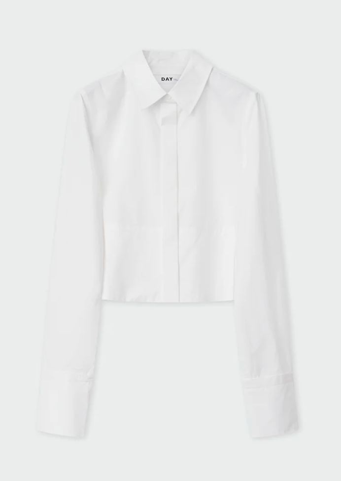 Cropped white shirt with classic collar and long sleeves with full length covered placket