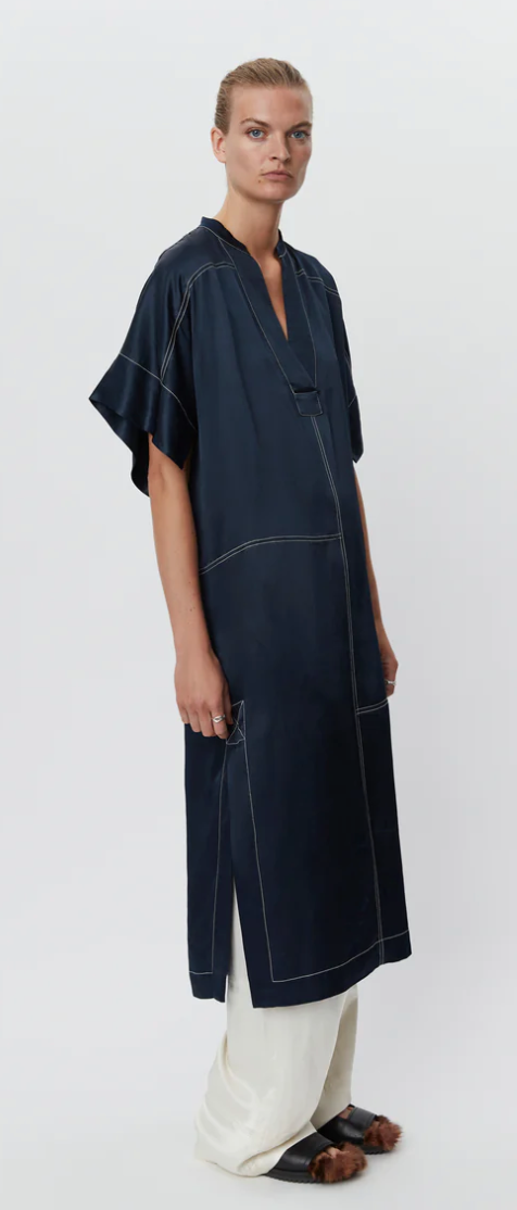 Navy slip on dress with a V neck and white top stitching