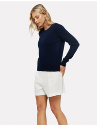 Navy crew neck jumper with V shaped back and pearl button fastening