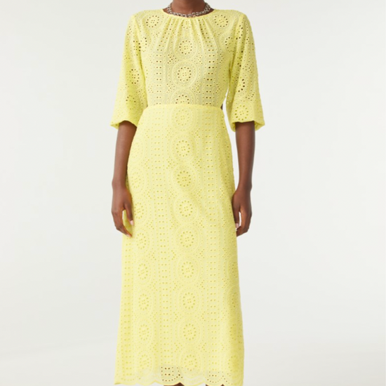 Yellow broderie anglais midi dress with three quarter length sleeves with waist cut outs and scalloped hem