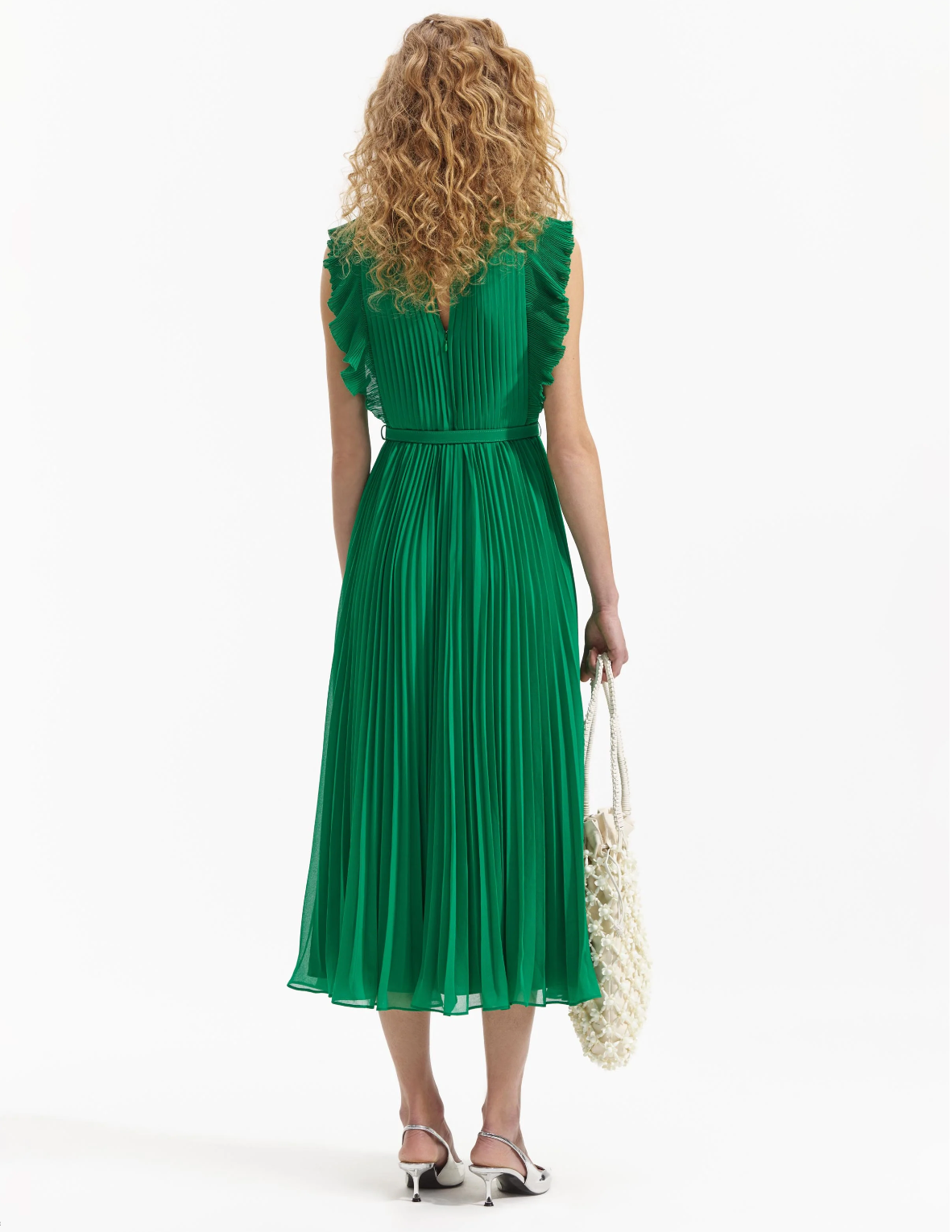 Emerald green sleeveless dress with pintuck bodice ruffle over the shoulder and midi length skirt with delicate pleats with fabric belt