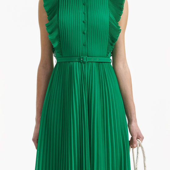 Emerald green sleeveless dress with pintuck bodice ruffle over the shoulder and midi length skirt with delicate pleats with fabric belt