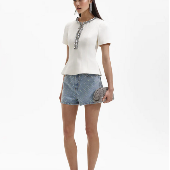 Ecru structured top with split crew neckline short sleeves and silver sequin and beaded detail about the neckline