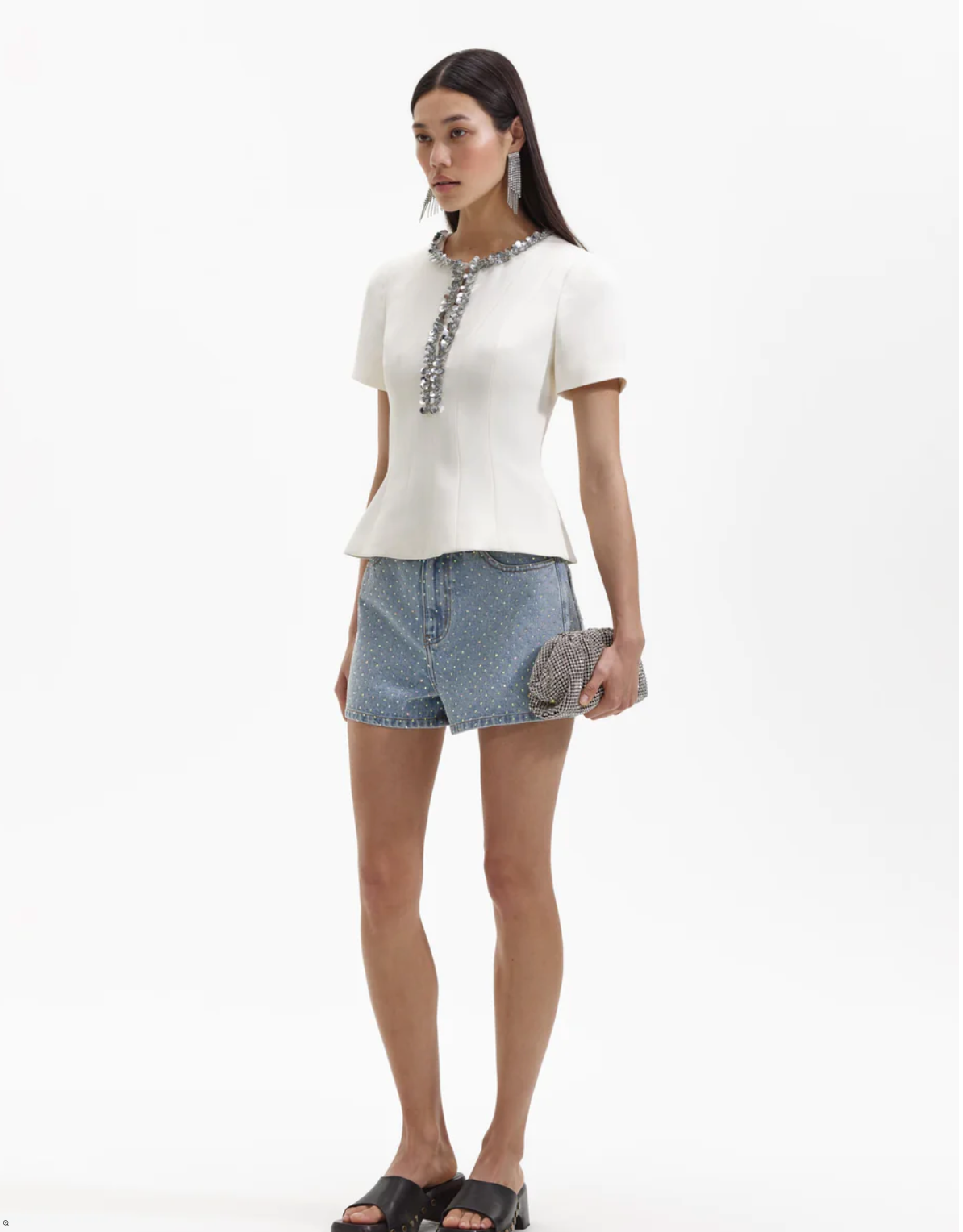 Ecru structured top with split crew neckline short sleeves and silver sequin and beaded detail about the neckline