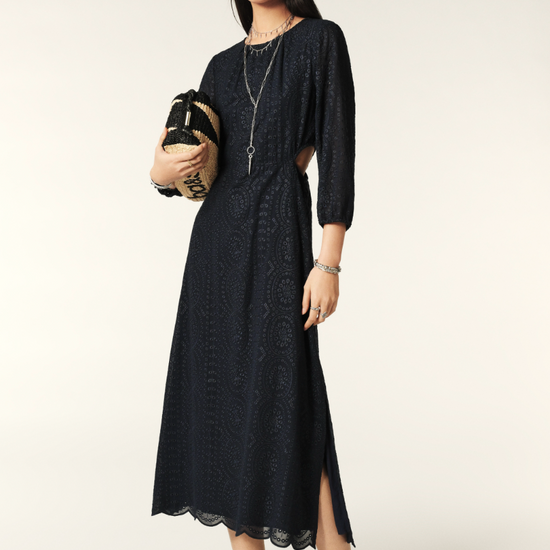 Navy midi dress with three quarter length sleeves waist cut outs and open back and scalloped hem with broderie anglais throughoutNavy midi dress with three quarter length sleeves waist cut outs and open back and scalloped hem with broderie anglais throughout