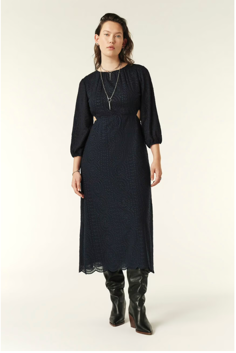 Navy midi dress with three quarter length sleeves waist cut outs and open back and scalloped hem with broderie anglais throughout