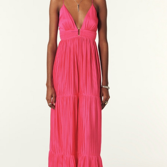 Fuchsia pink maxi dress with a deep v neckline and spaghetti straps that lace up the back