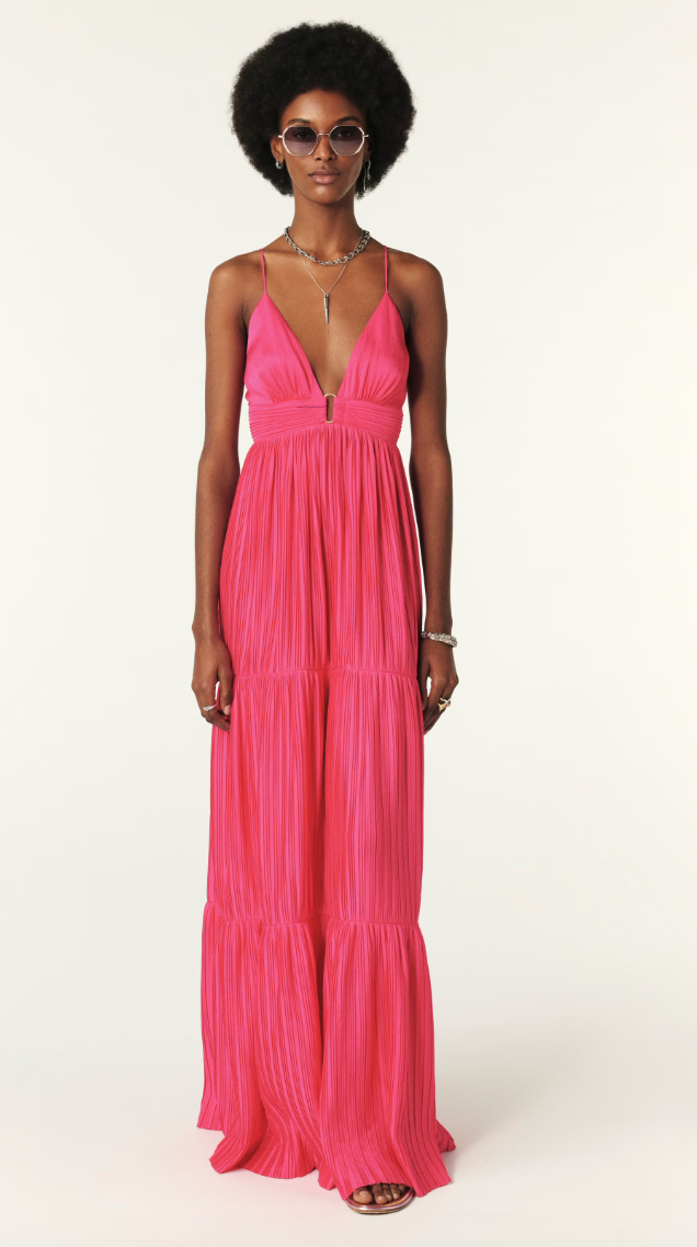Fuchsia pink maxi dress with a deep v neckline and spaghetti straps that lace up the back