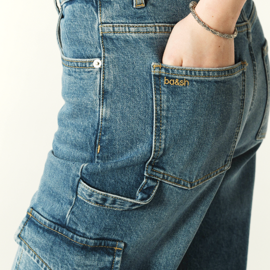 Straight cut loose fit jeans with leg pocket details