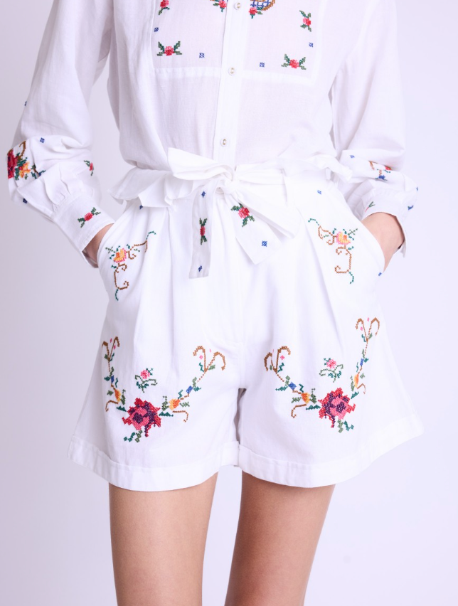 White paperbag shorts with colourful floral cross stitch details pleated front and pockets
