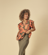 Printed viscose top with frill sleeves and tie detail at the neck model shot