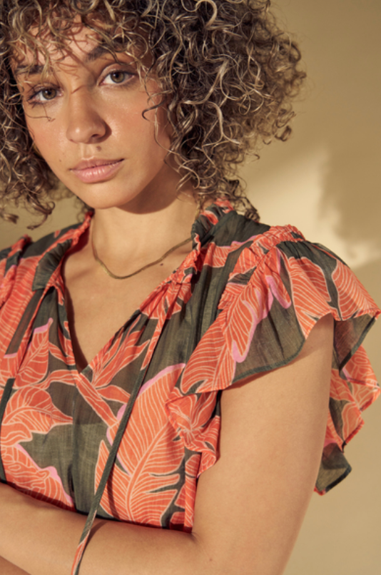 Printed viscose top with frill sleeves and tie detail at the neck close up