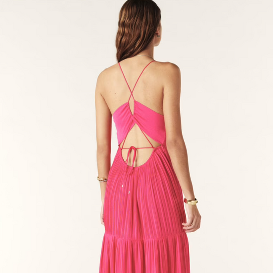 Fuchsia pink maxi dress with a deep v neckline and spaghetti straps that lace up the back