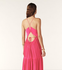 Fuchsia pink maxi dress with a deep v neckline and spaghetti straps that lace up the back