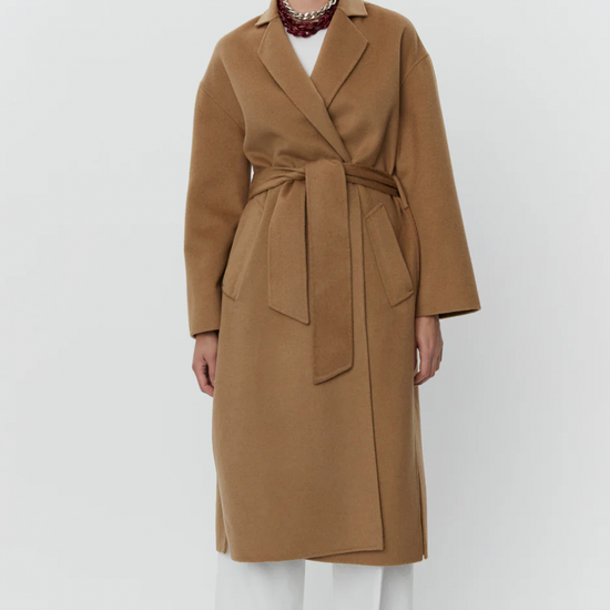 camel coat with belt and side slits front view