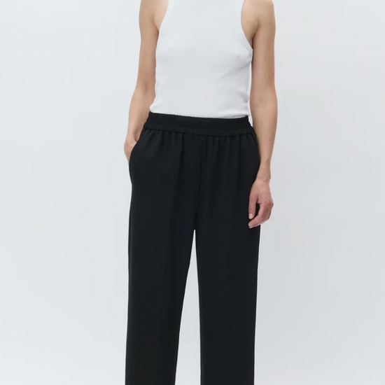 black cropped trousers with elasticated waist model shot