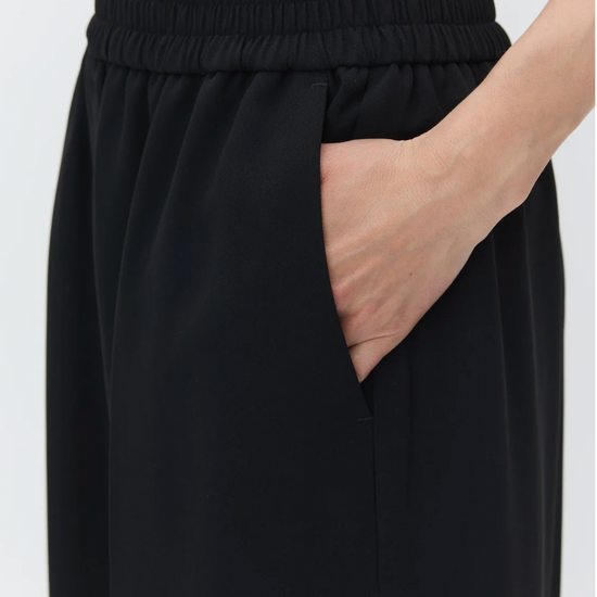 black cropped trousers with elasticated waist close up