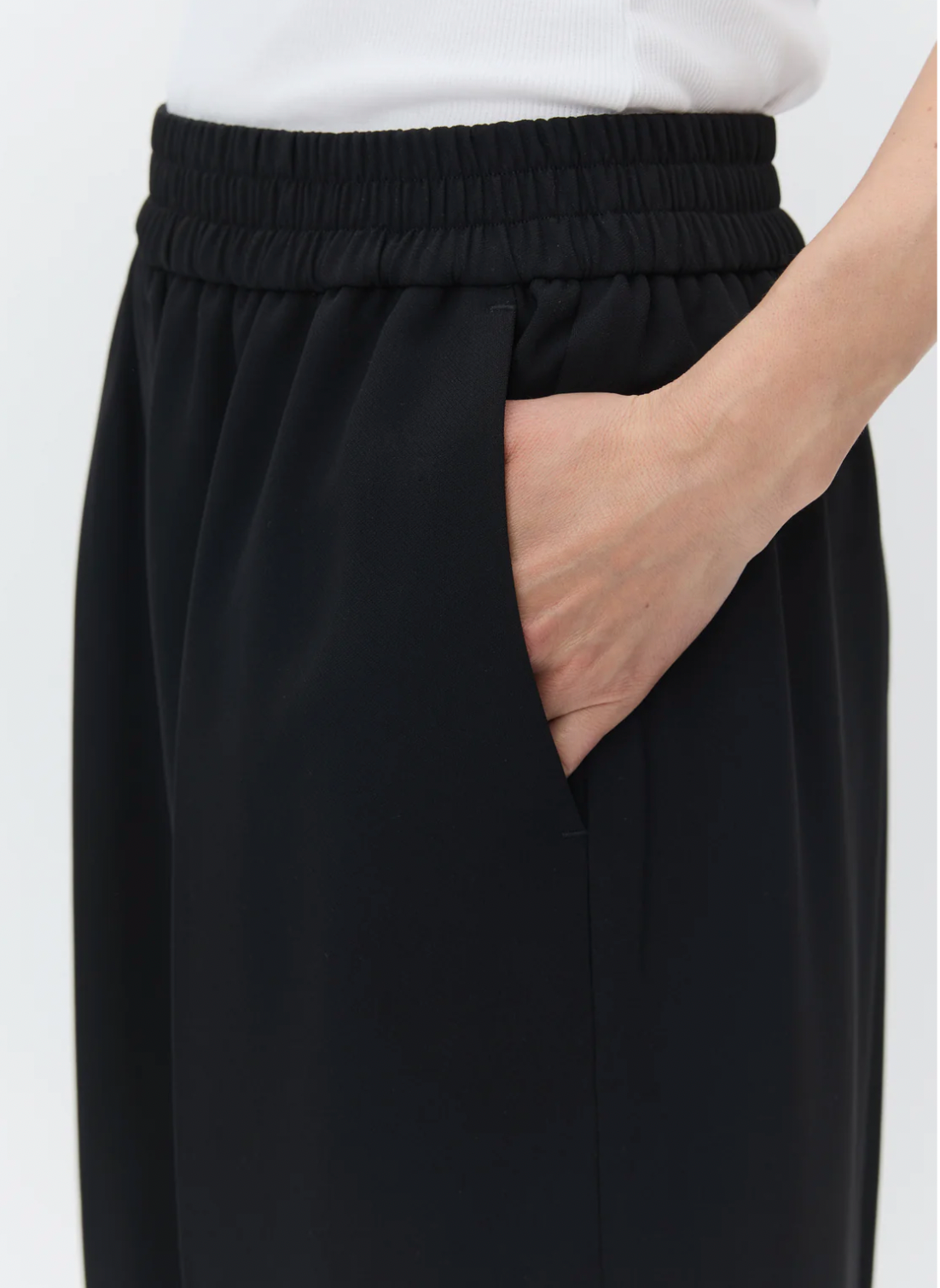 black cropped trousers with elasticated waist close up