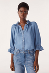 blue denim shirt with ruffled neck and cuffs model shot