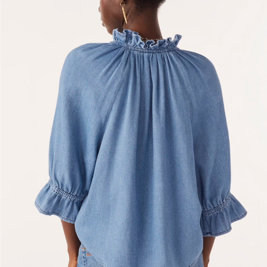 blue denim shirt with ruffled neck and cuffs rear view