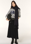 Navy and white striped sweatshirt with a blue decal on the front worn with skirt