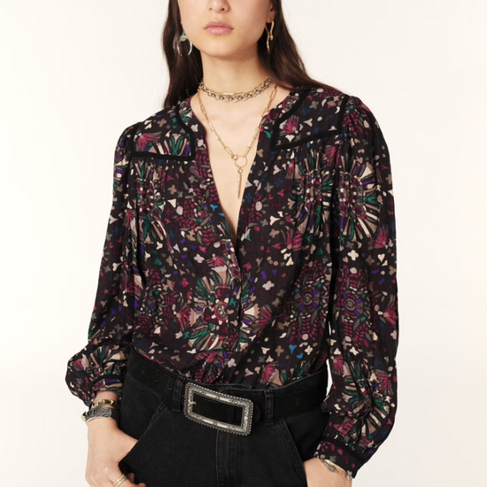 Women wearing dark floral top.