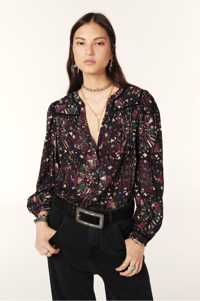 Women wearing dark floral top.