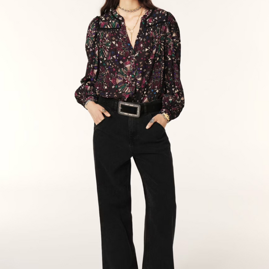 Women wearing dark floral top. 