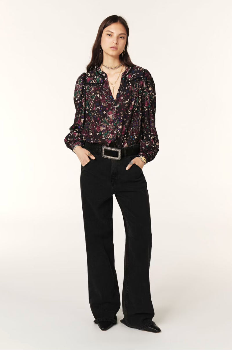 Women wearing dark floral top. 