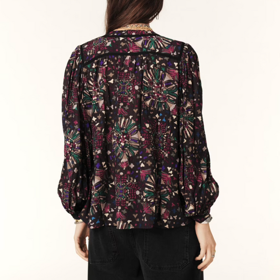 Women wearing dark floral top.