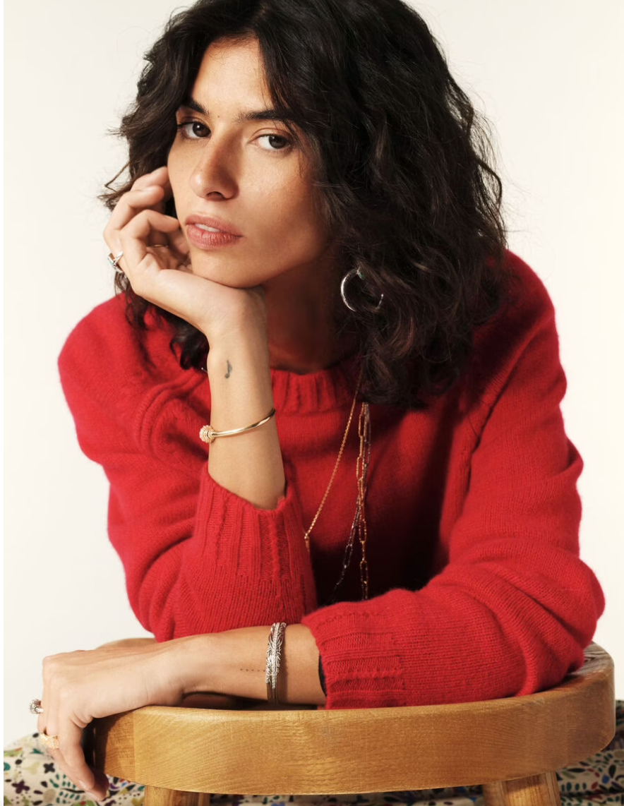 red cashmere jumper with raglan sleeves and zip at the neck close up