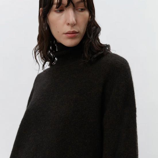 chocolate brown turtleneck jumper with ribbed cuffs, hem and neck close up