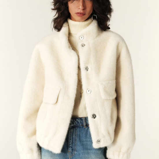 off white faux fur jacket with elasticated waist and cuffs with high neck and pockets model shot