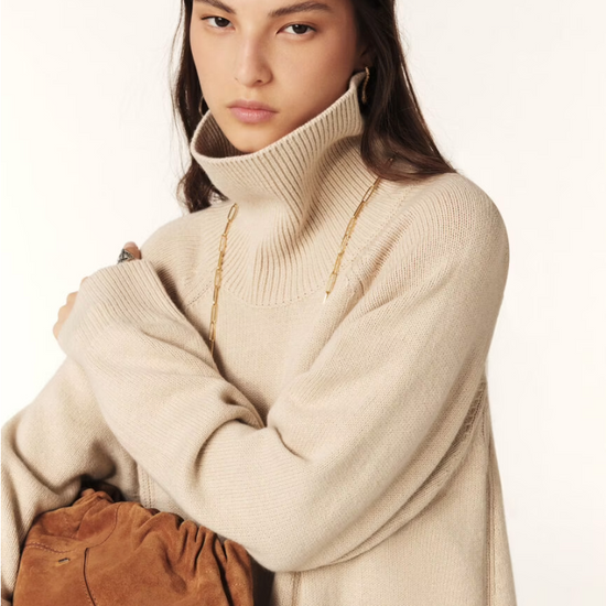 beige jumper dress with ribbed neck and cuffs and turtle neck close up