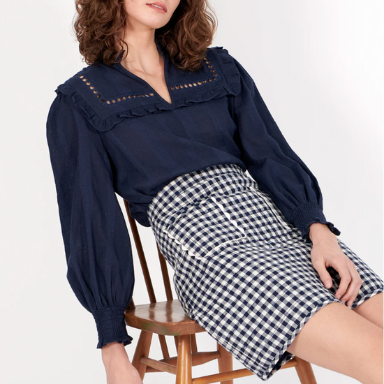 navy shirt with elasticated cuffs, ruffled collar and lace detail